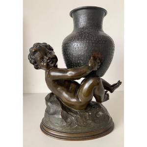 Bronze Subject Representing A Putto Holding A Jar