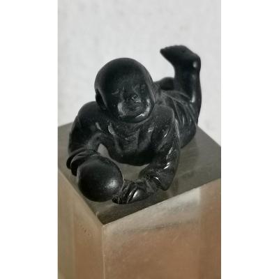 Curious Netsuke B,lack Lacquered Bronze, Child And Ball, Japan Meiji Period, 19thc