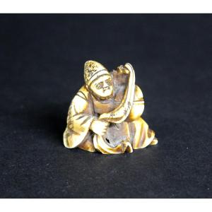 Antique Japanese Ivory Netsuke Depicting A Man With A Mokugyo Bell Zen Buddhist ,