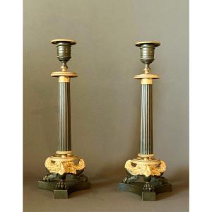 A Pair Of Restauration Patinated And Gilt Bronze Candlesticks. Circa 1820