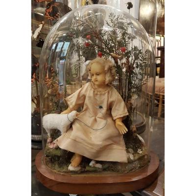 Odditie And Religious Object: Child In Wax And Sheep Under His Globe