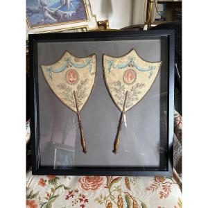 Pair Of Hand Screens Under Showcase Frame.