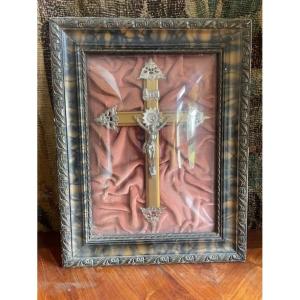 A Silver-plated Christ Under Curved Glass