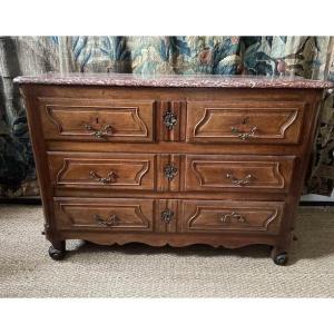 18th Century Chest Of Drawers In Natural Wood With A Wavy Side.