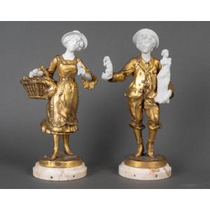 A Pair Of Bronze And Biscuit Porcelain Sculptures, Late 19th Century 