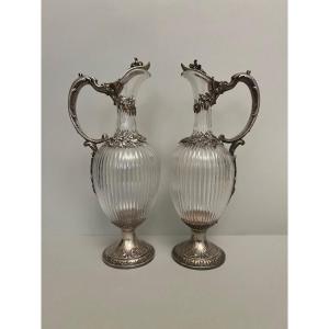 A Pair Of Silver And Cut Glass Ewers.