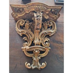 Consolle Luigi XIV in legno intagliato e dorato.