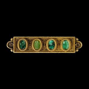 An Etruscan Revival Gold Brooch Set With Roman Green Chalcedony Intaglios.
