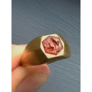A Gold Signet Ring Set With A Roman Carnelian Intaglio. Rooster Hunting A Snake On A Vase.