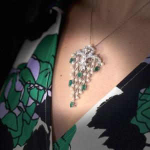 A Gold Emerald Diamonds And Pearl Fishnet Pendant.