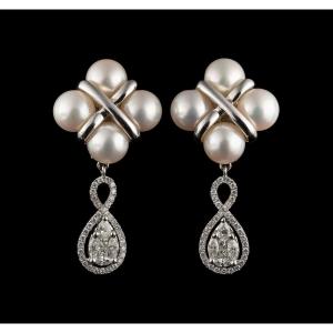 A Pair Of 18k White Gold Earrings With Pearls