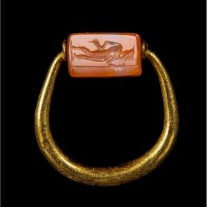 A Graeco-persian Gold Swivel Ring With A Carnelian Engraved Seal. Mercury And Male Figure.