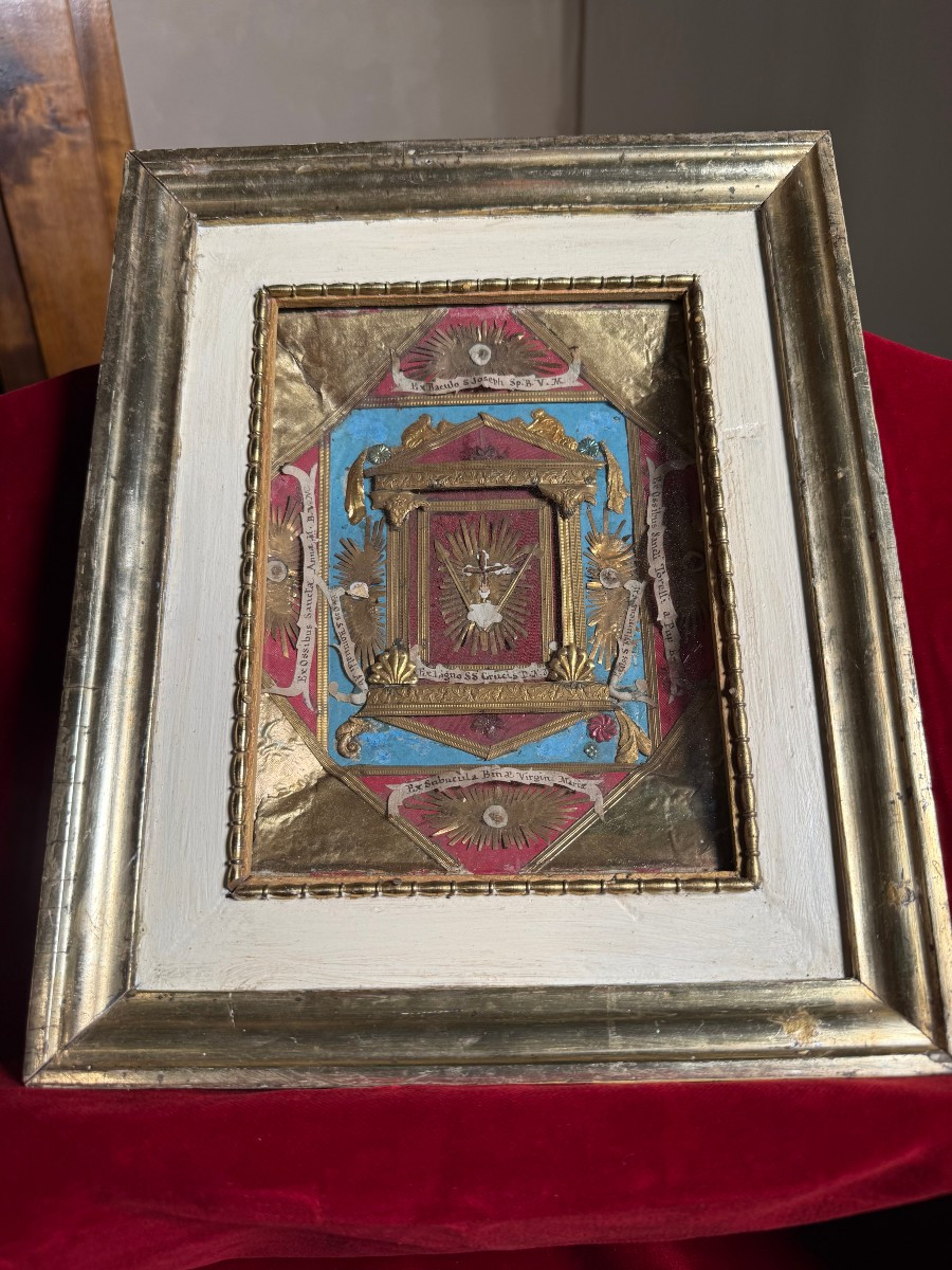 Quadro-reliquiario paperolle con 7 reliquie fra cui la S.Croce di N.S.G.C. 