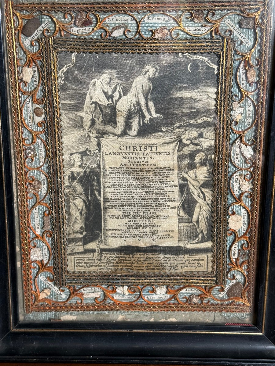 Quadro reliquiario  in cornice lignea ebanizzata con 24 frammenti di reliquie  