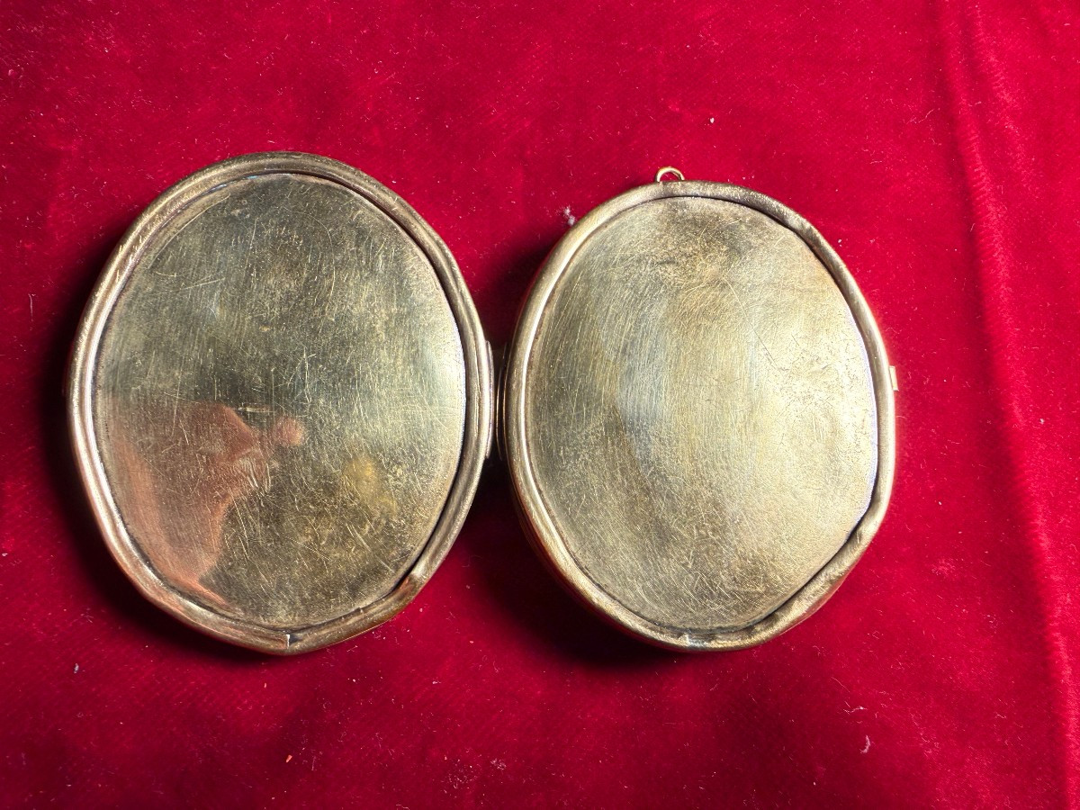 Reliquiario a medaglione a doppia faccia con 27 reliquie -photo-1