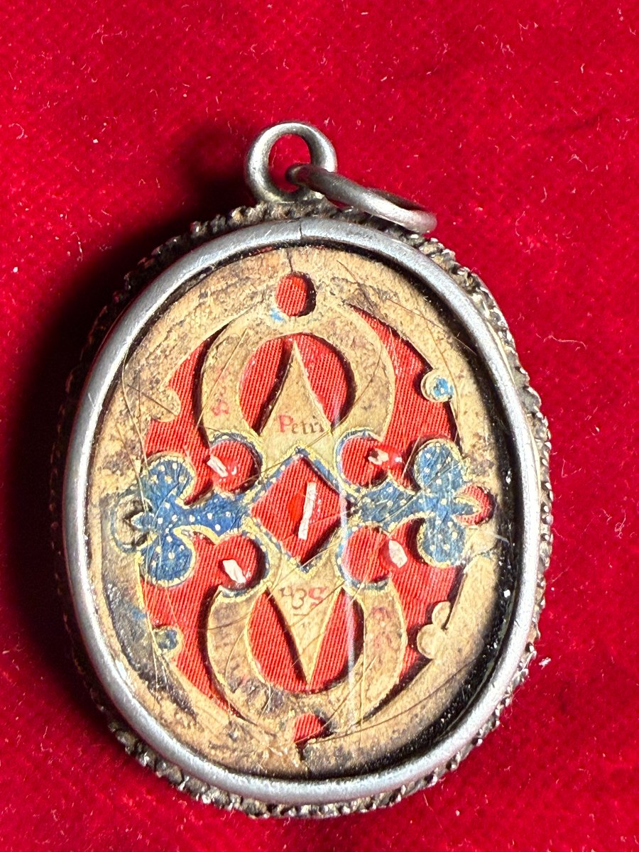 Reliquiario in filigrana d'argento double face con all'interno varie  reliquie di Santi  