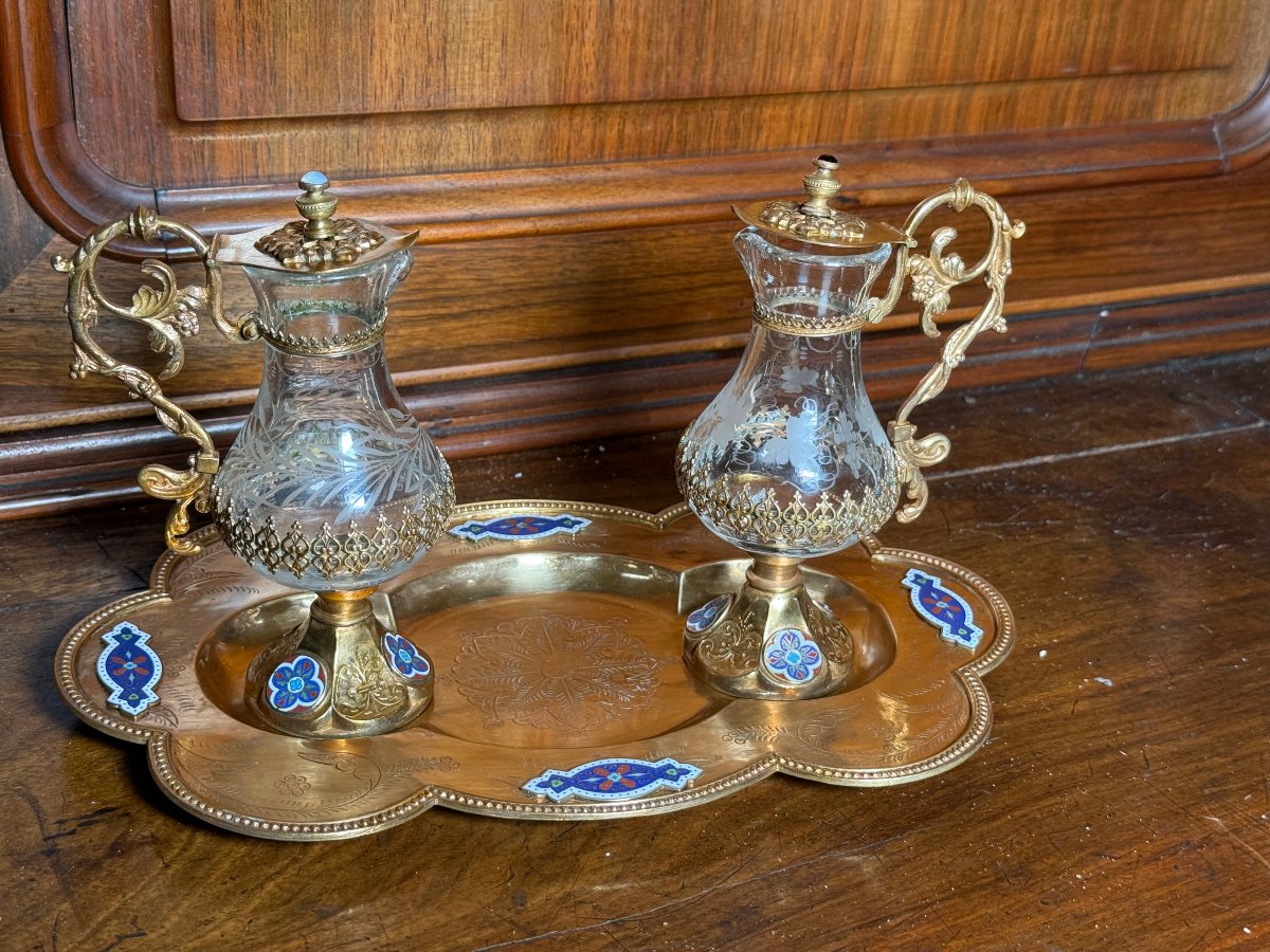 Ampolline  in bronzo dorato e smalti e cristallo molato  con loro vassoio  