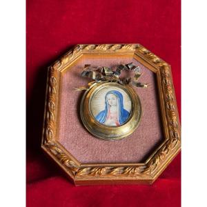 Quadretto con cornice in bronzo e argento con avorietto dipinto della B.V.M. al suo interno