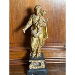 Statuetta lignea dorata del '700 rappresentante Maria col Bambino con reliquia 