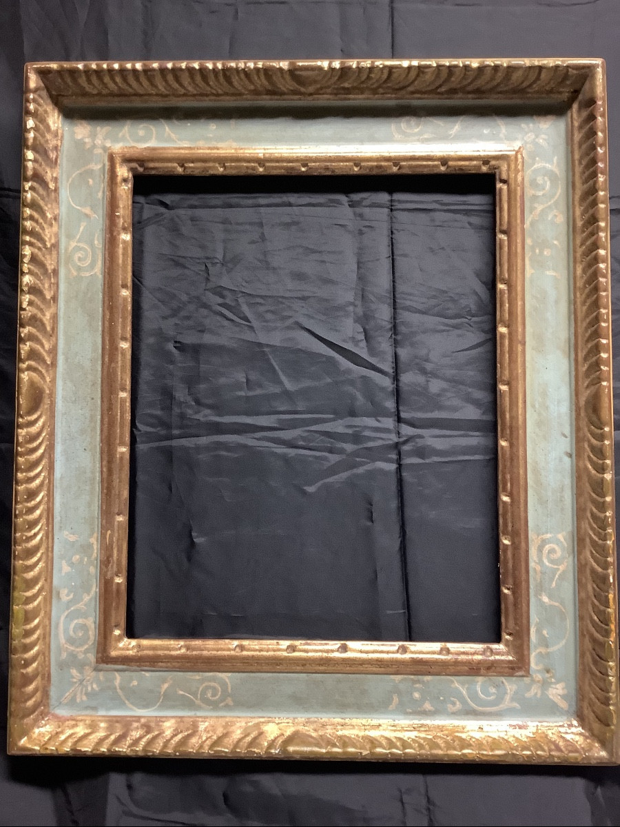 Cornice in legno intagliata  laccata e dorata co motivi Ep XX secolo