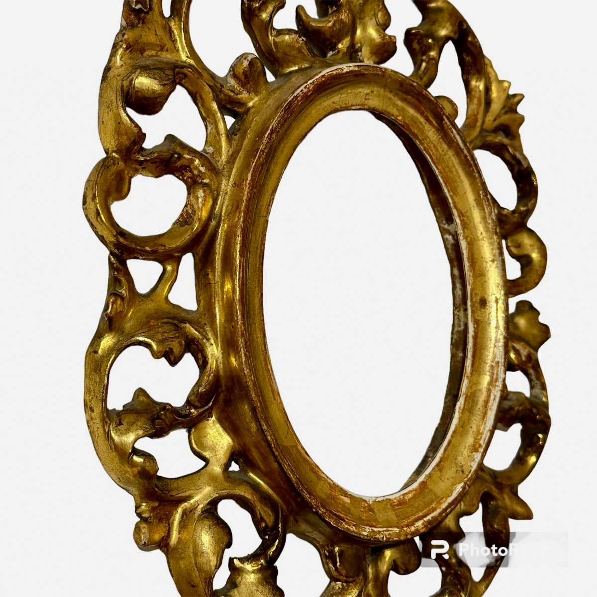 Cornice ovale in legno intagliato e dorato, Toscana XIX secolo. -photo-1
