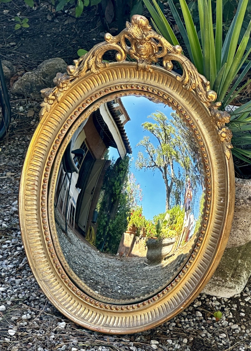 Specchio “Sorcière” in legno dorato, XIX secolo