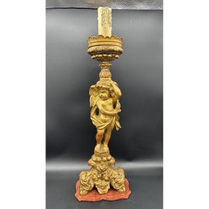 Candeliere in legno dorato intagliato e dorato con figura di putto - XVIII sec  
