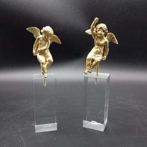 COPPIA DI PUTTI ALLEGORICI IN BRONZO DORATO DEL XVIII SECOLO