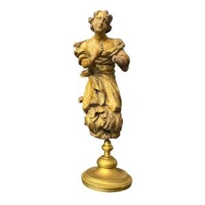 Scultura in legno intagliato e dorato 