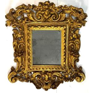Specchiera in legno scolpito, intagliato e dorato, Toscana, inizi del XVIII secolo