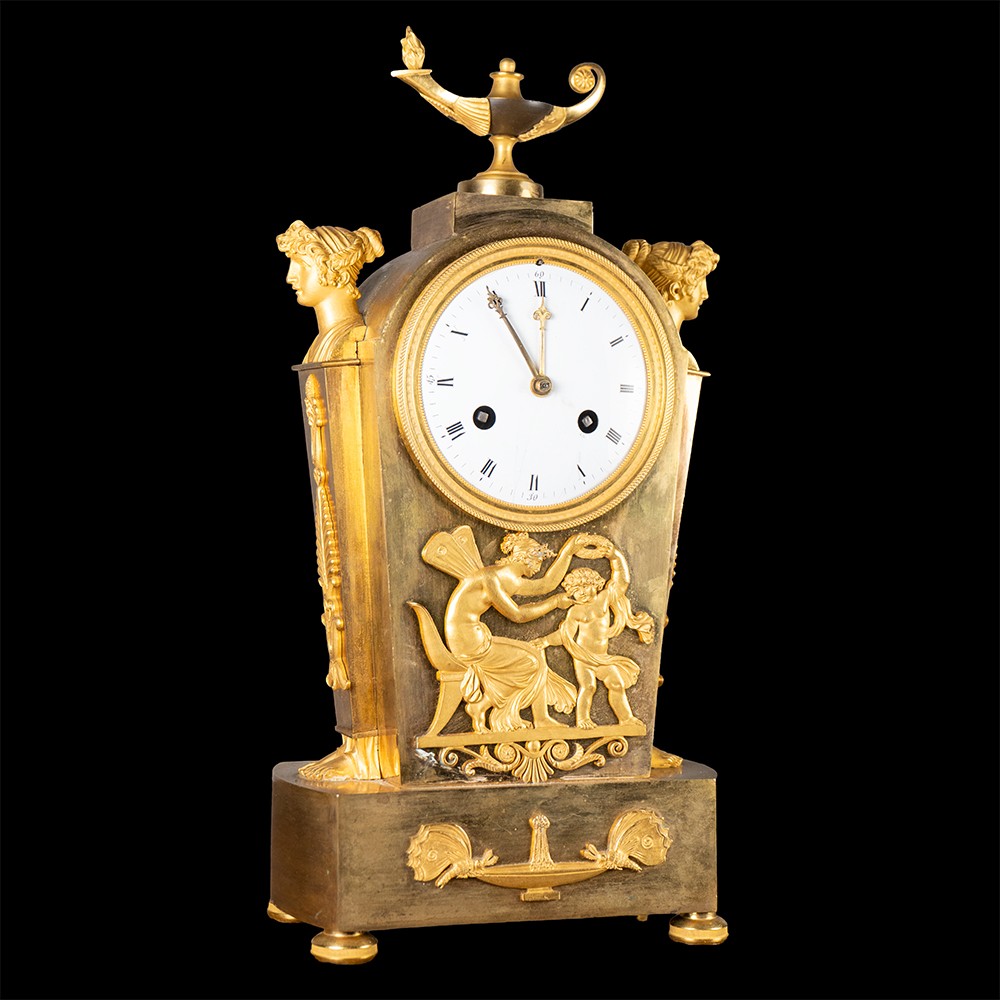 Orologio in bronzo cesellato e dorato