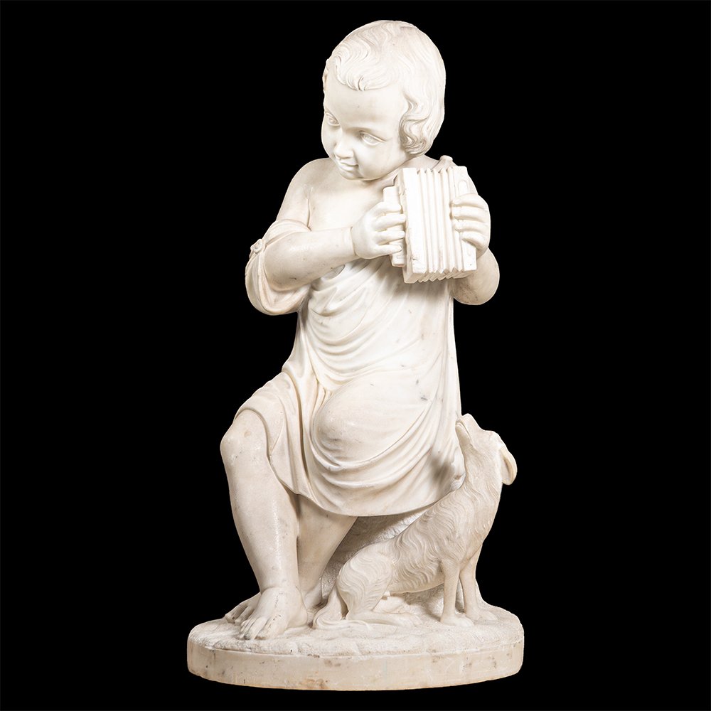 Scultura in marmo raffigurante fanciullo con cane