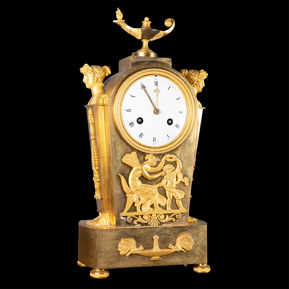 Orologio in bronzo cesellato e dorato