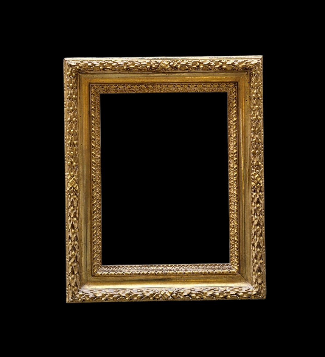 Cornice in legno intagliato e dorato