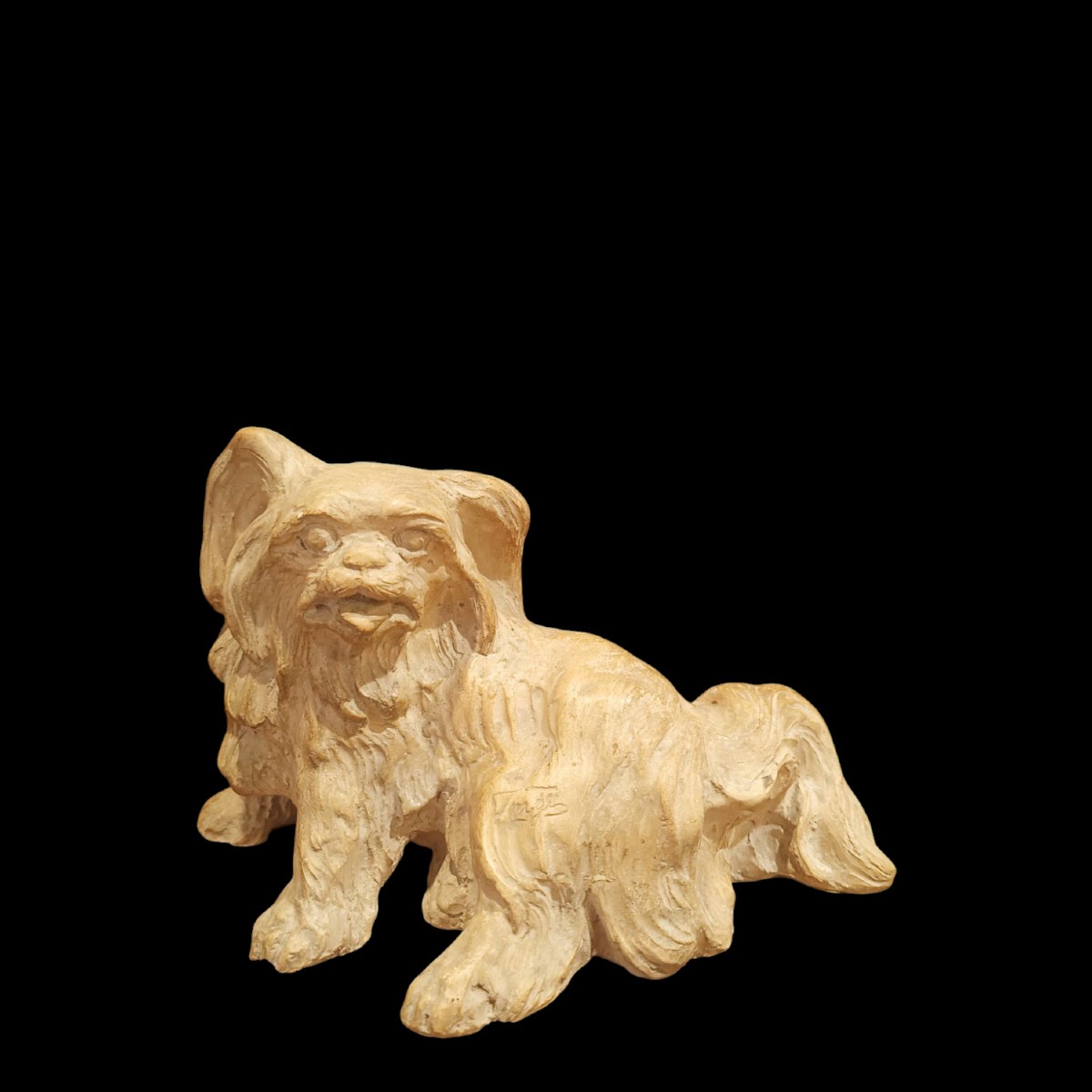 Scultura terracotta raffigurante un cane.Inizio XX secolo.