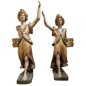 Importante coppia di angeli reggicero in legno policromo e dorato,Siena,fine XVI secolo.