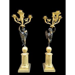 Coppia di grandi candelabri in bronzo dorato.Francia,inizio XIX secolo.