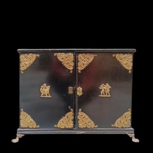 Monetiere in legno ebanizzato.Inizio XIX