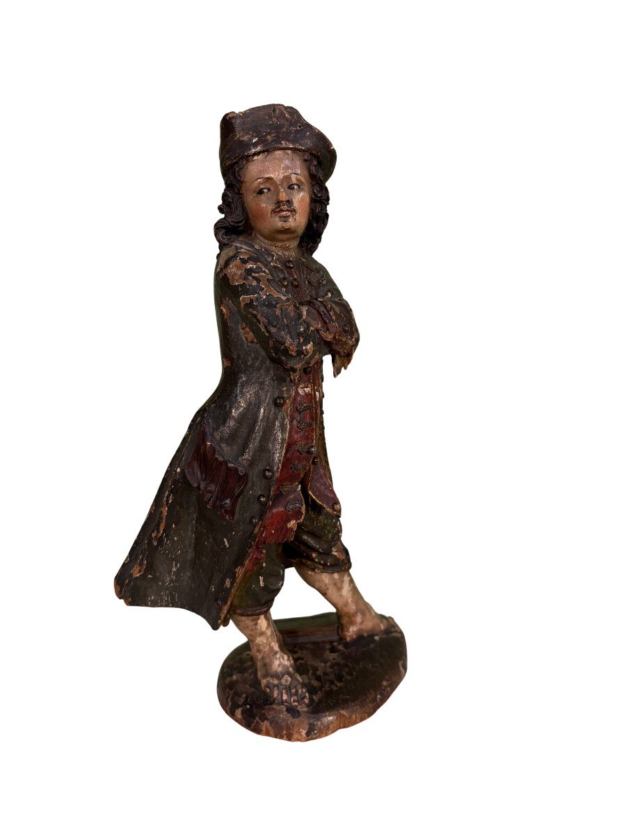Scultura in legno laccato in policromia con applicazioni in metallo