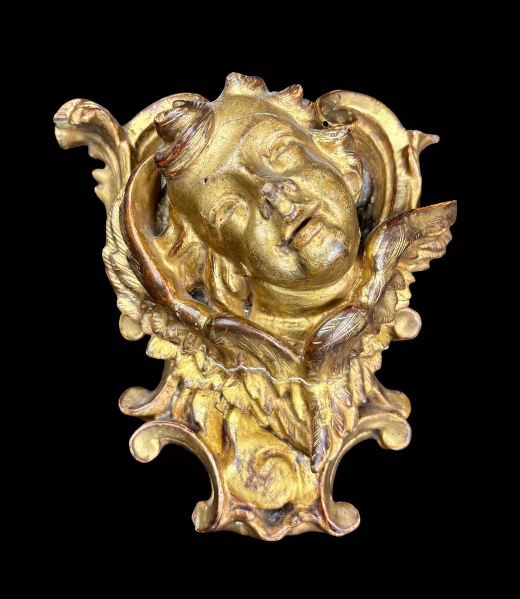 Putto in legno intagliato e dorato
