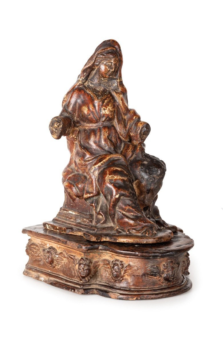 Gruppo in terracotta dipinta di ambito emiliano poggiante su base anch'essa in terracotta con t