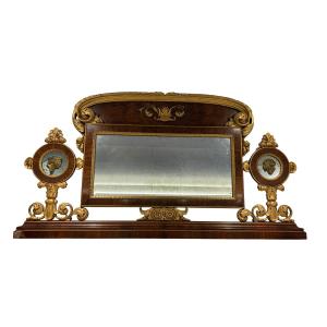 Caminiera impero lastronata in noce con decori in legno intagliato e dorato