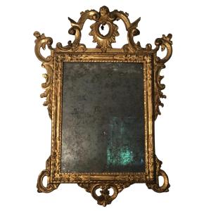 Specchiera in legno intagliato e dorato