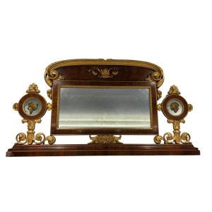 Caminiera impero lastronata in noce con decori in legno intagliato e dorato