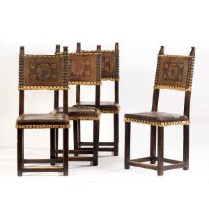 gruppo di 4 sedie in noce con cuoio impresso con stemmi 