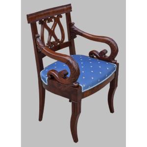 Poltrona Impero in mogano intagliato, braccioli a ricciolo, Italia primi ‘800