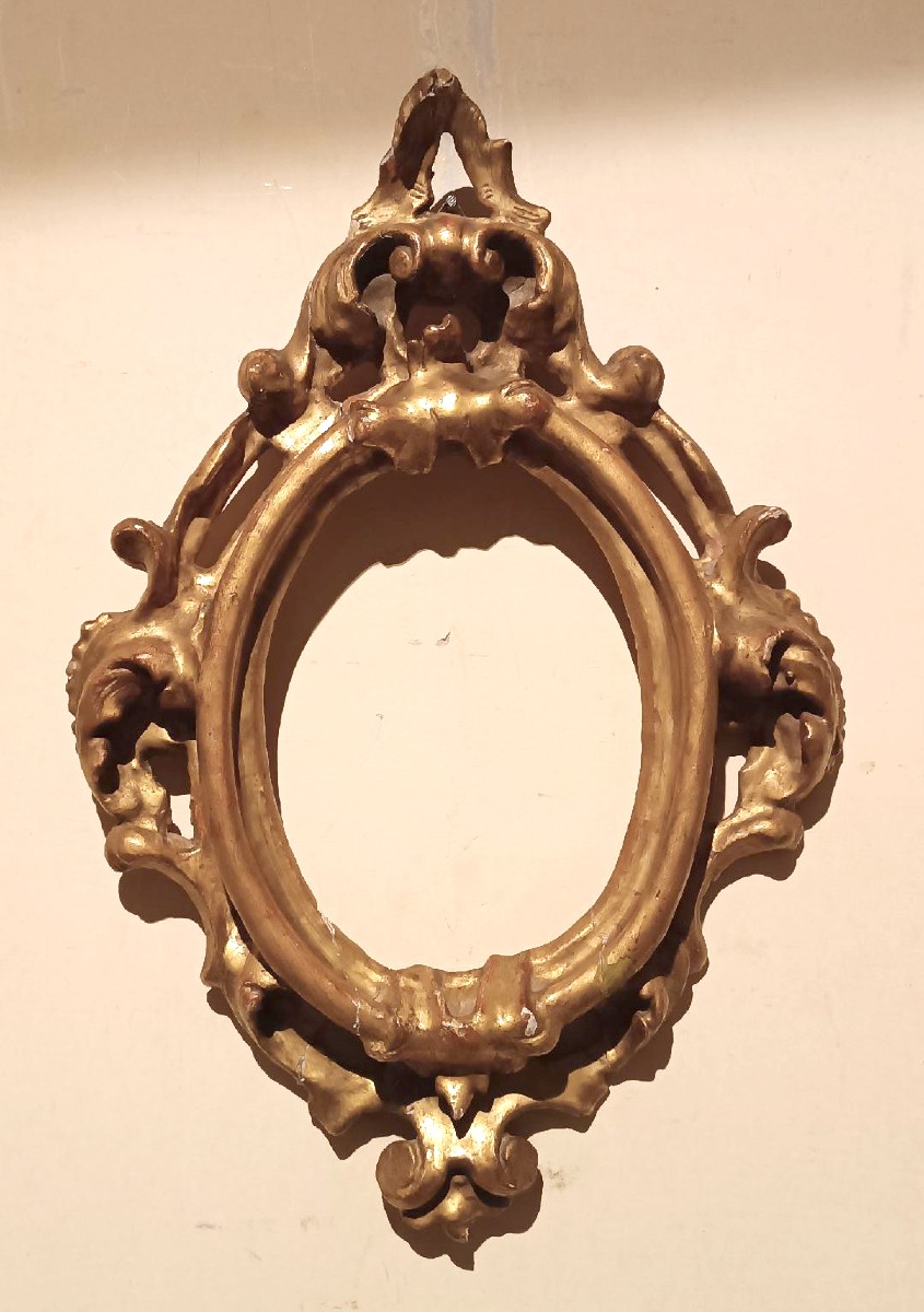 Cornice antica ovale dorata e intagliata Luigi XIV -Toscana XVII secolo