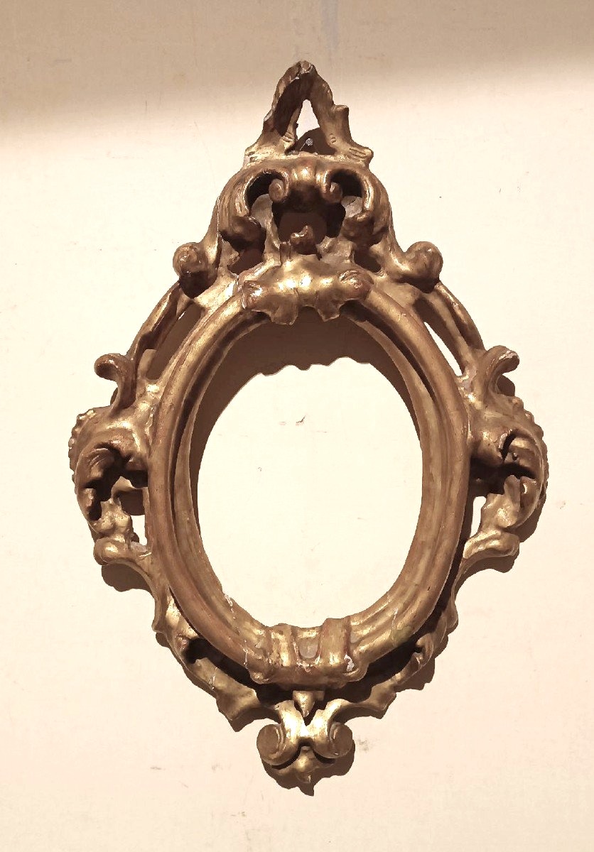 Cornice antica ovale dorata e intagliata Luigi XIV -Toscana XVII secolo 51x34 cm
