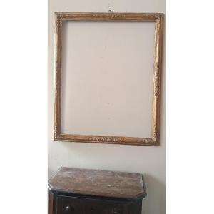Cornice antica in legno dorato con intagli floreali