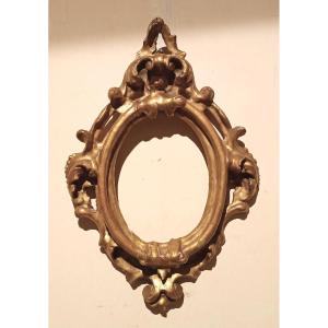 Cornice antica ovale dorata e intagliata Luigi XIV -Toscana XVII secolo